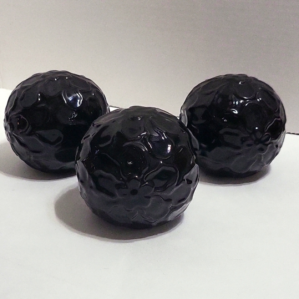 3 - 3" black ceramic floral decorative orbs.